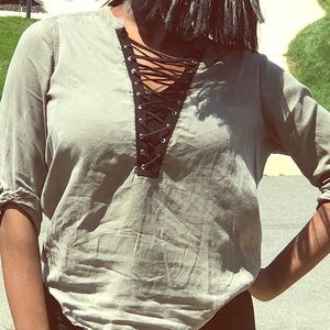 A green and black string shirt